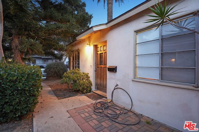 property entrance with a patio