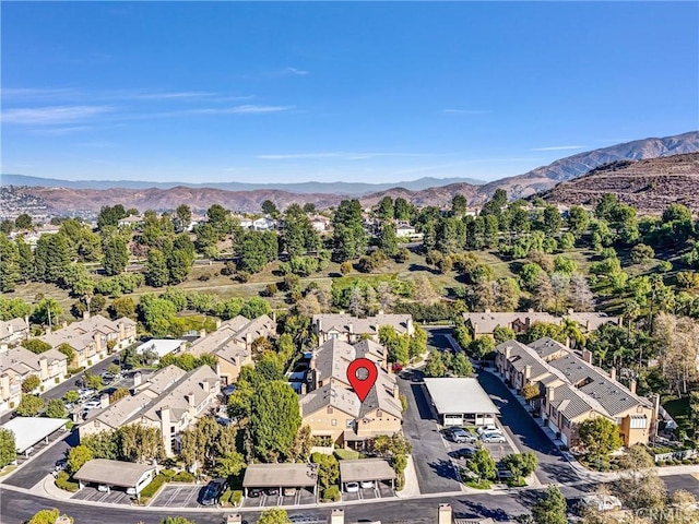 birds eye view of property with a mountain view