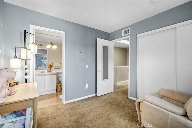 living area featuring sink and light carpet