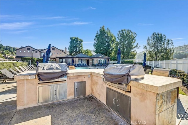 view of patio with a grill and area for grilling