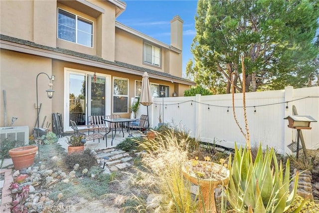 back of house with a patio area