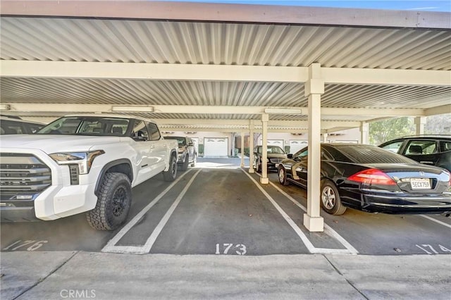 garage featuring a carport