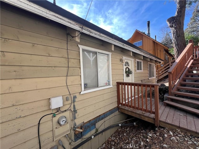 view of side of home with a deck