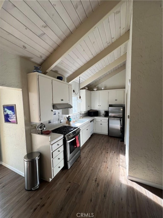 kitchen with white cabinets, stainless steel appliances, sink, dark hardwood / wood-style floors, and lofted ceiling with beams