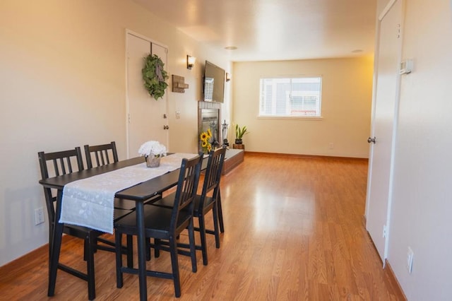 dining space with light wood-type flooring