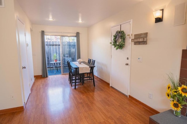 dining room with light hardwood / wood-style flooring