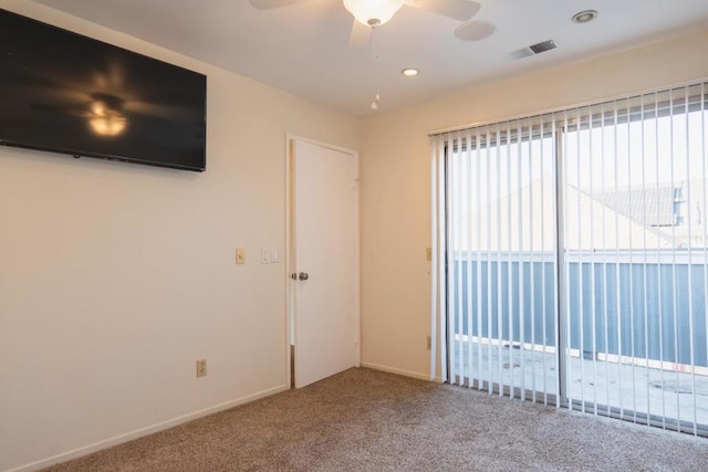 empty room featuring carpet and ceiling fan