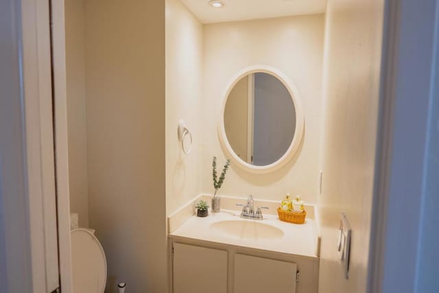 bathroom featuring vanity and toilet