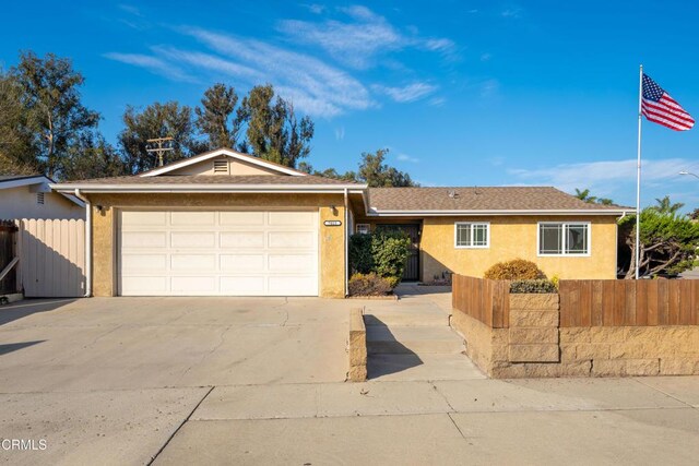 single story home with a garage