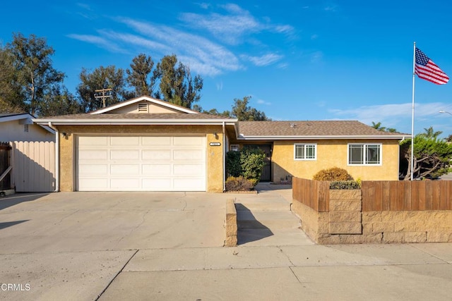 ranch-style home featuring a garage