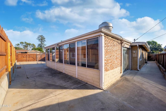 view of side of property featuring a patio area