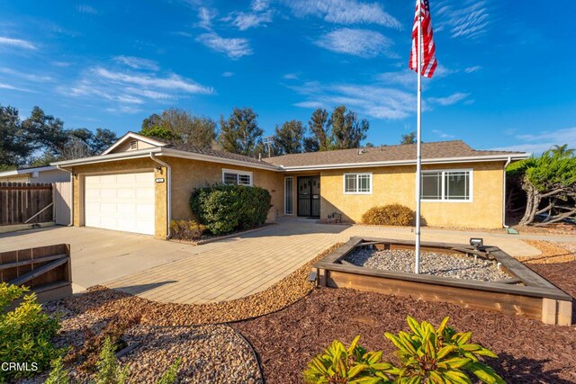 ranch-style house featuring a garage