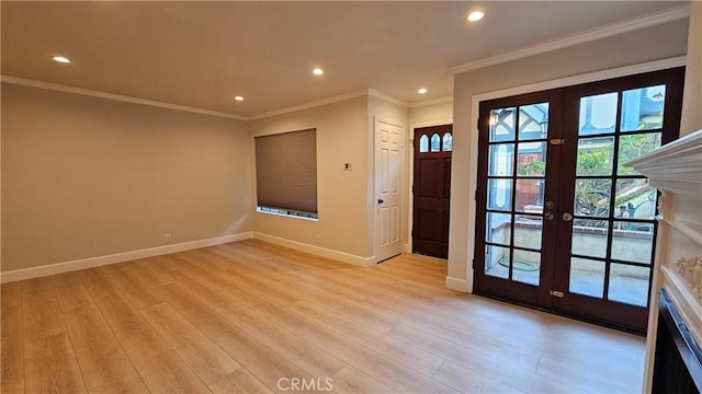 interior space featuring crown molding, light hardwood / wood-style flooring, and french doors