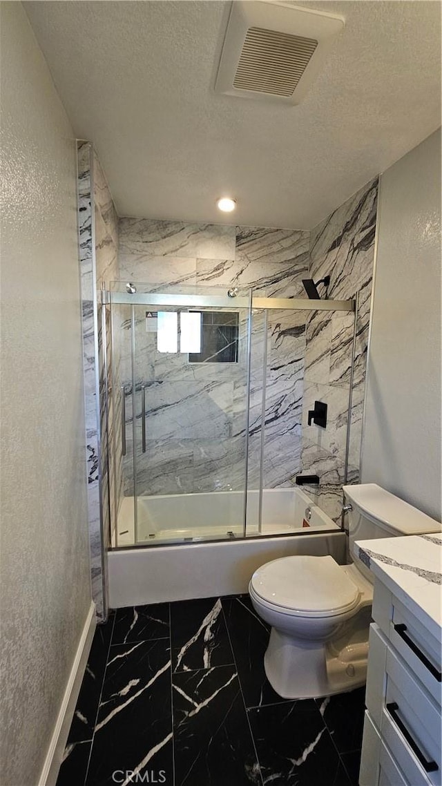 full bathroom with toilet, vanity, shower / bath combination with glass door, and a textured ceiling