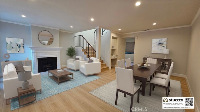 dining room with light hardwood / wood-style flooring and ornamental molding