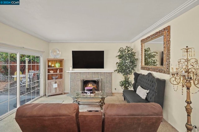 carpeted living room with crown molding and a fireplace