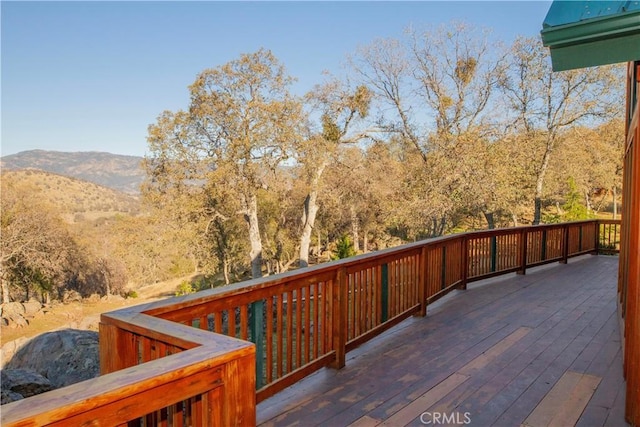 wooden deck featuring a mountain view