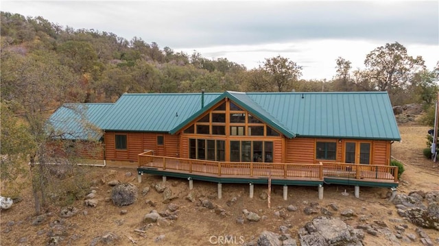 back of property featuring a wooden deck