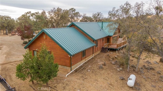 view of home's exterior with a wooden deck