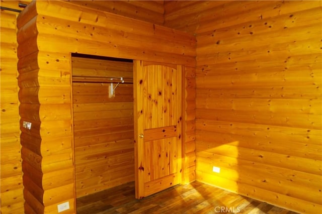 bathroom with hardwood / wood-style flooring