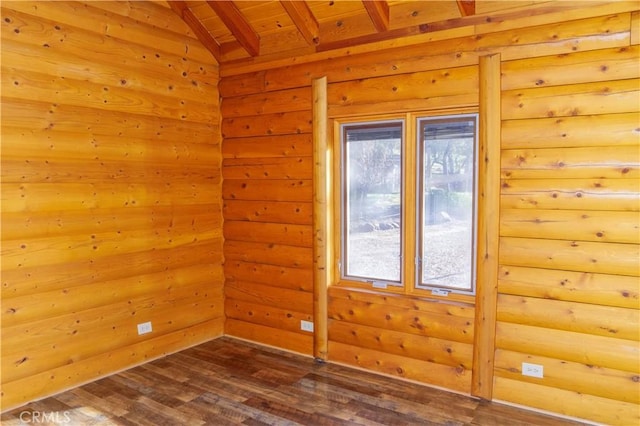 spare room with rustic walls, dark hardwood / wood-style flooring, wood ceiling, and vaulted ceiling with beams