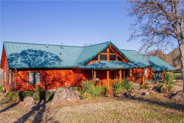 log cabin with a porch