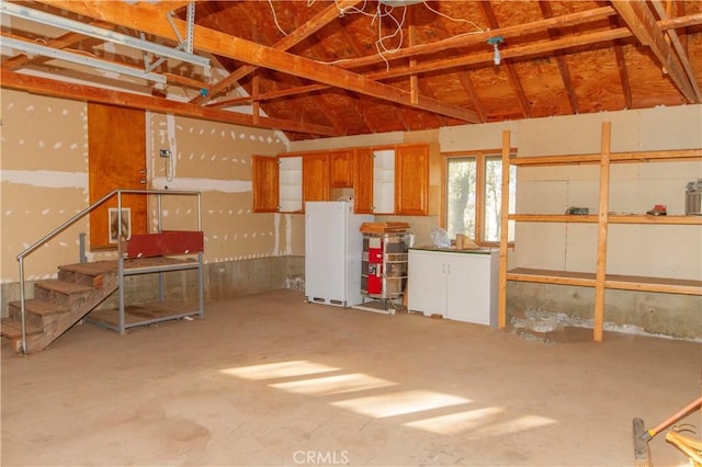 garage featuring white refrigerator