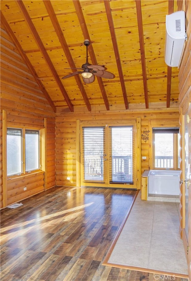 unfurnished living room with log walls, wood-type flooring, high vaulted ceiling, wooden ceiling, and beam ceiling