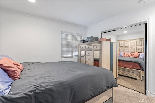 bedroom featuring light carpet, a closet, and crown molding