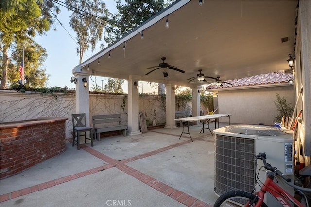 view of patio featuring central AC and ceiling fan