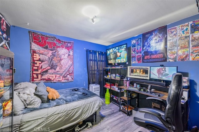 bedroom featuring hardwood / wood-style flooring