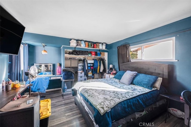 bedroom featuring dark wood-type flooring