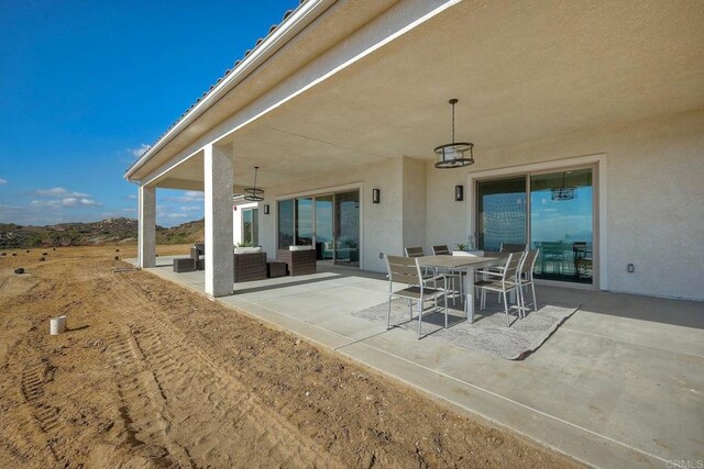 view of patio featuring ceiling fan and an outdoor hangout area