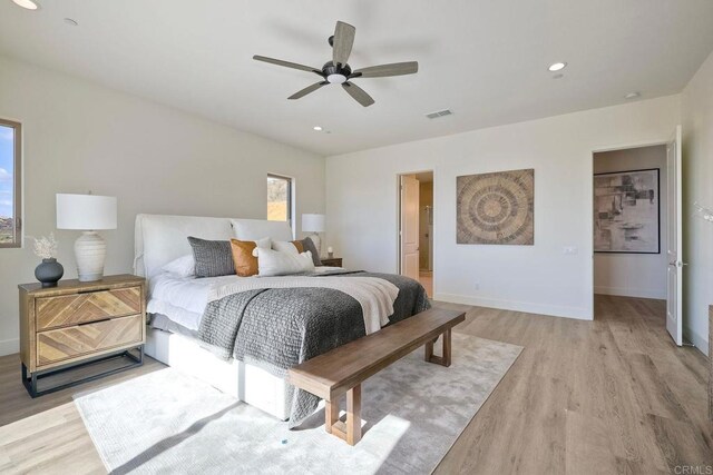 bedroom featuring ceiling fan and light hardwood / wood-style flooring