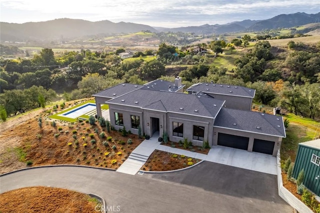 drone / aerial view featuring a mountain view