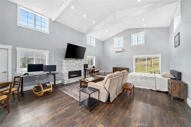 living room with dark hardwood / wood-style flooring, a high ceiling, a stone fireplace, and beamed ceiling