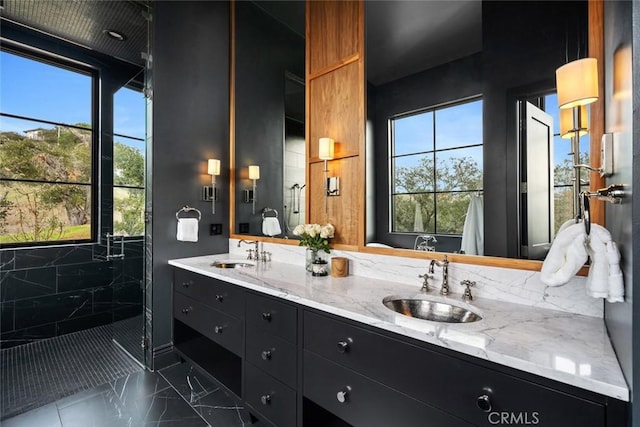 bathroom featuring vanity and tiled shower