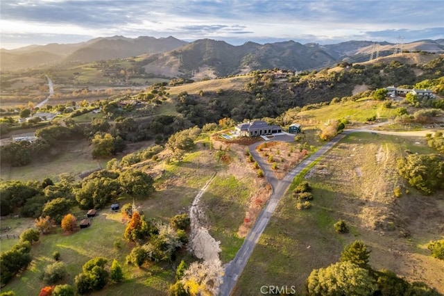 birds eye view of property with a mountain view