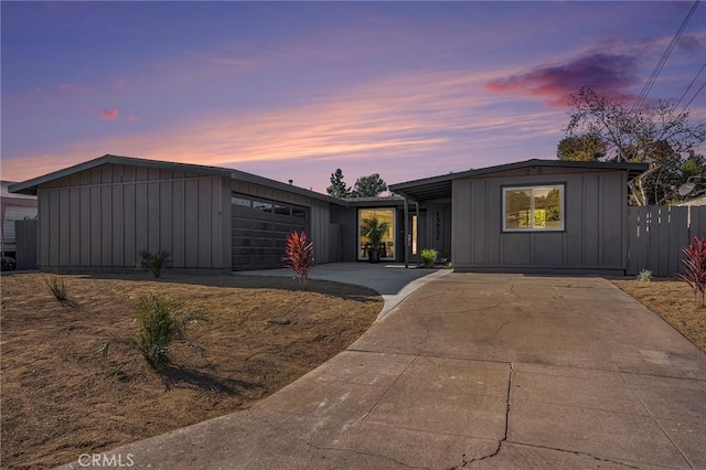 ranch-style home featuring a garage