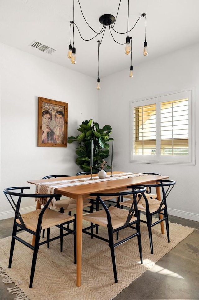 dining room with a chandelier