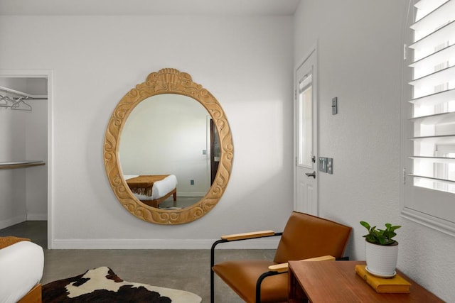 living area featuring concrete flooring