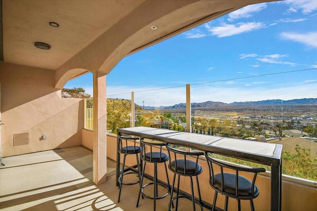 balcony featuring a mountain view