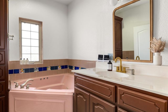 bathroom with a bathtub and vanity