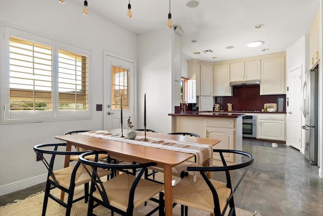 kitchen with stainless steel appliances and cream cabinets