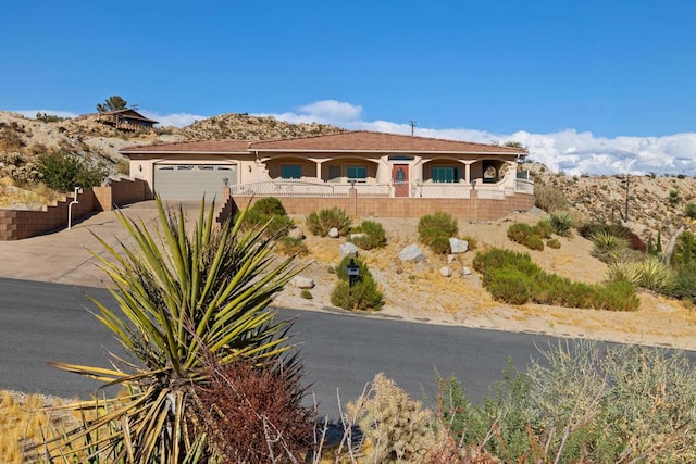 view of front of property with a garage