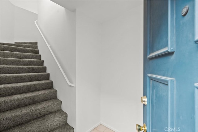 stairway featuring tile patterned floors