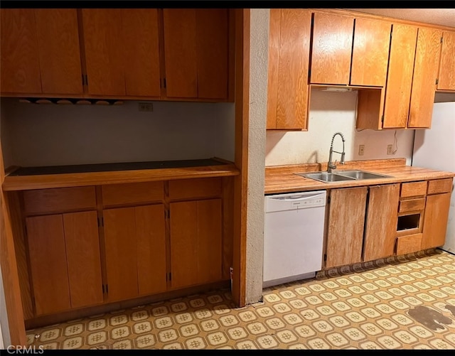 kitchen with dishwasher, sink, and refrigerator