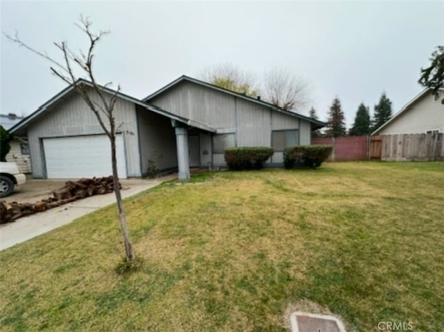 ranch-style house with a garage and a front yard