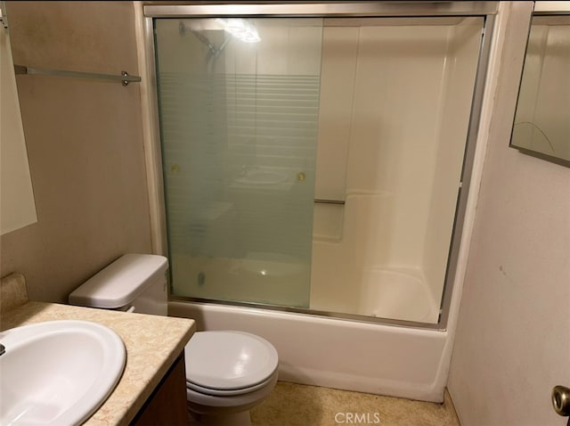 full bathroom with toilet, bath / shower combo with glass door, and vanity