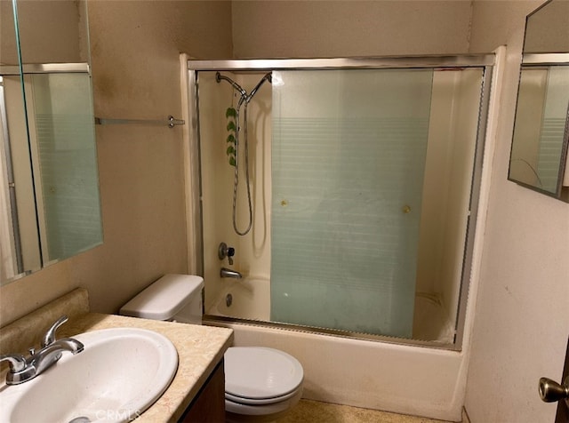 full bathroom with toilet, vanity, and combined bath / shower with glass door